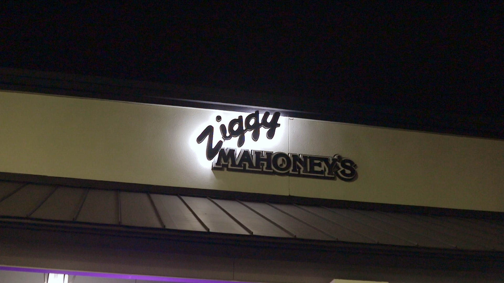 Lit Ziggys sign above the entrance at night